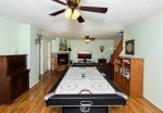 Downstairs game room with air hockey table